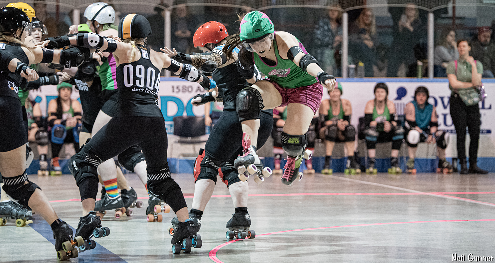 Home Page hero image 6: Roller derby jammer jumps the apex