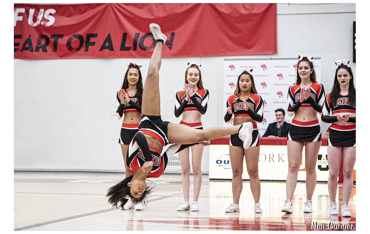 Cheerleader does a flip